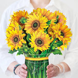 woman holding sunflower bouquet