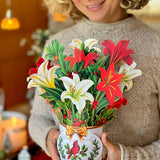 Winter Joy bouquet of lilies and holly