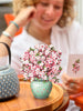 a woman holding a bouquet of flowers