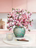 a vase with pink flowers