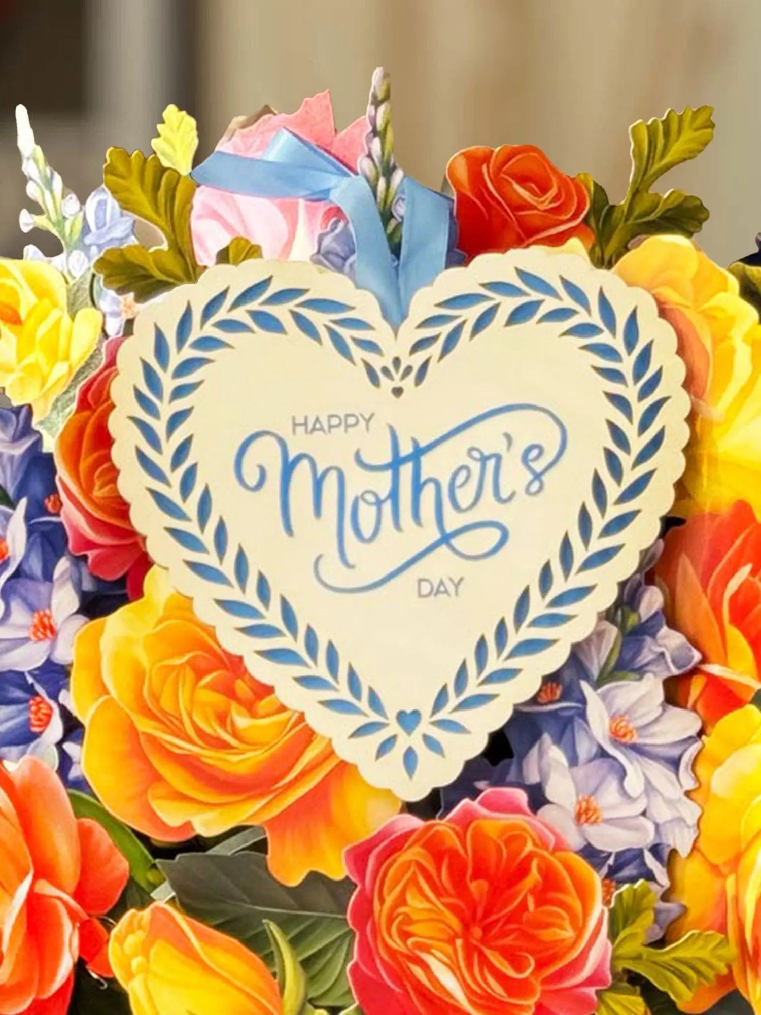 a heart shaped sign with flowers