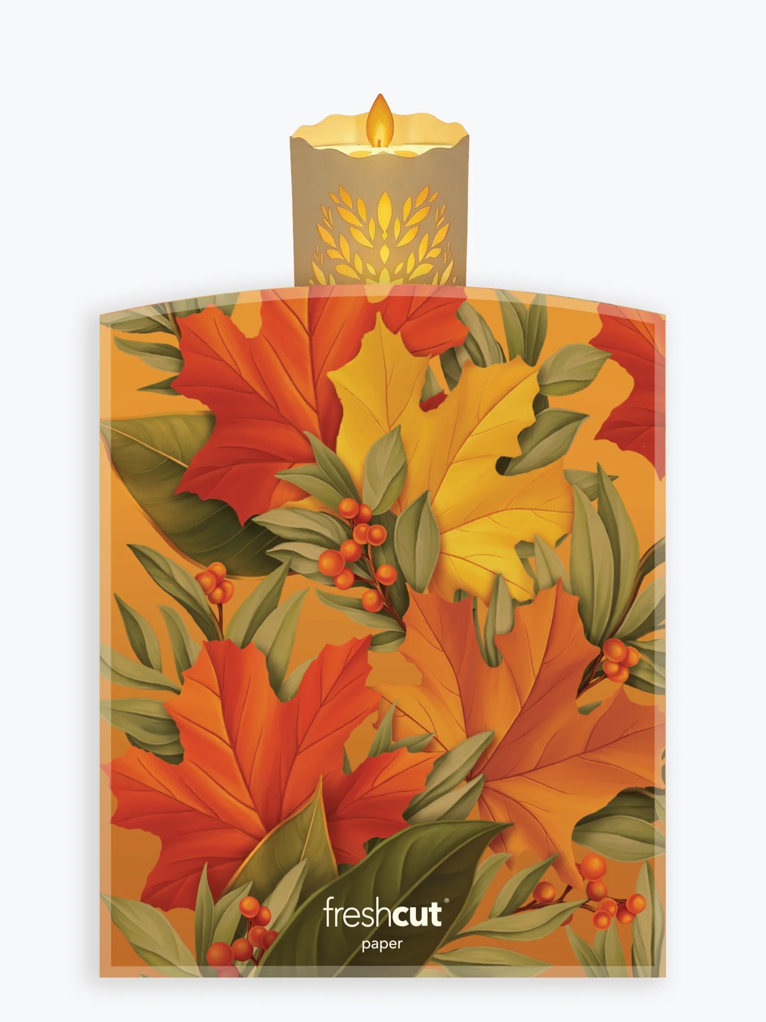 A pack of Freshcut paper sheets featuring an autumn leaf pattern with red, orange, yellow, and green leaves, berries, and a lit candle illustration at the top, shown on a light gray background.