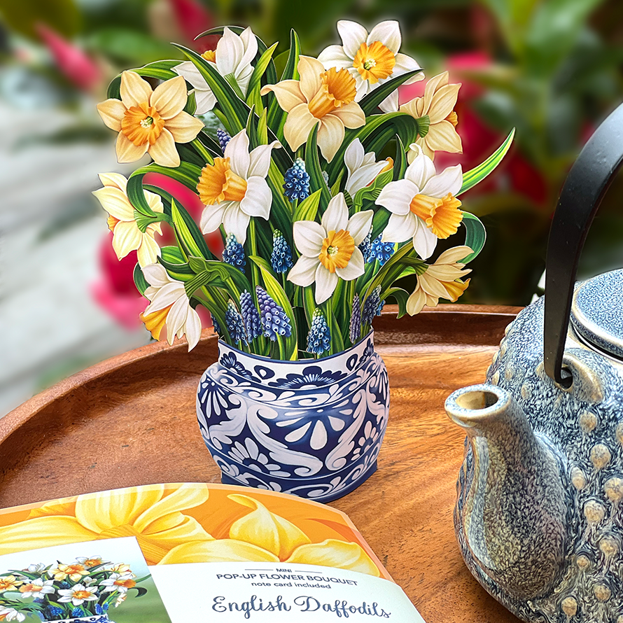 A mini pop-up daffodil with a paper blue and white vase