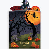 Branded envelope packaging with the Haunted House pop-up scene peeking out of the top, featuring a haunted house, bats, and spooky trees against an orange full moon.