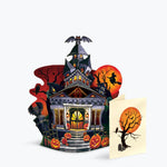 Halloween-themed pop-up card with a haunted house design on a light grey background