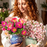 Person holding two pop-up flower bouquets included in the Garden Party Set.