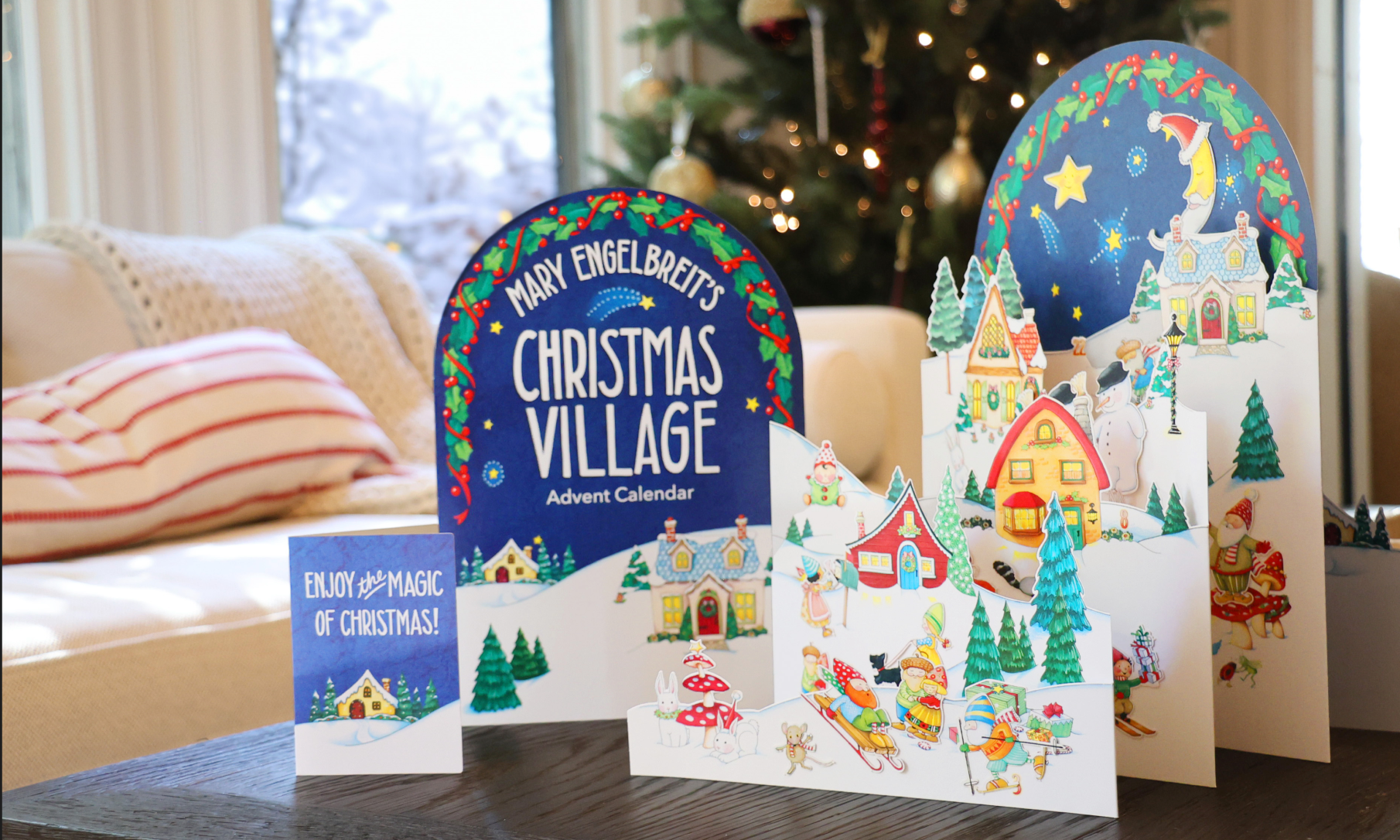 Christmas village advent calendar with festive decorations in a home setting