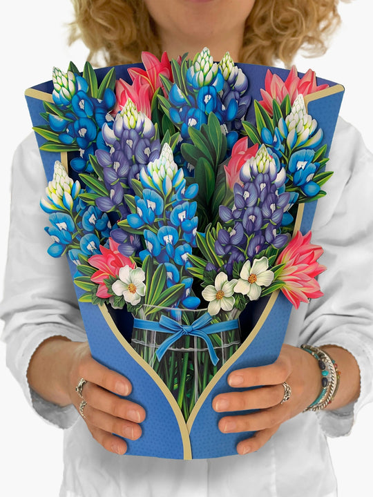 FreshCut Paper "Blue Bonnet" measure 12'' tall by 9" wide. Our stunning life sized, 3D pop up flowers include paper vase, matching note card and festive mailing envelope.