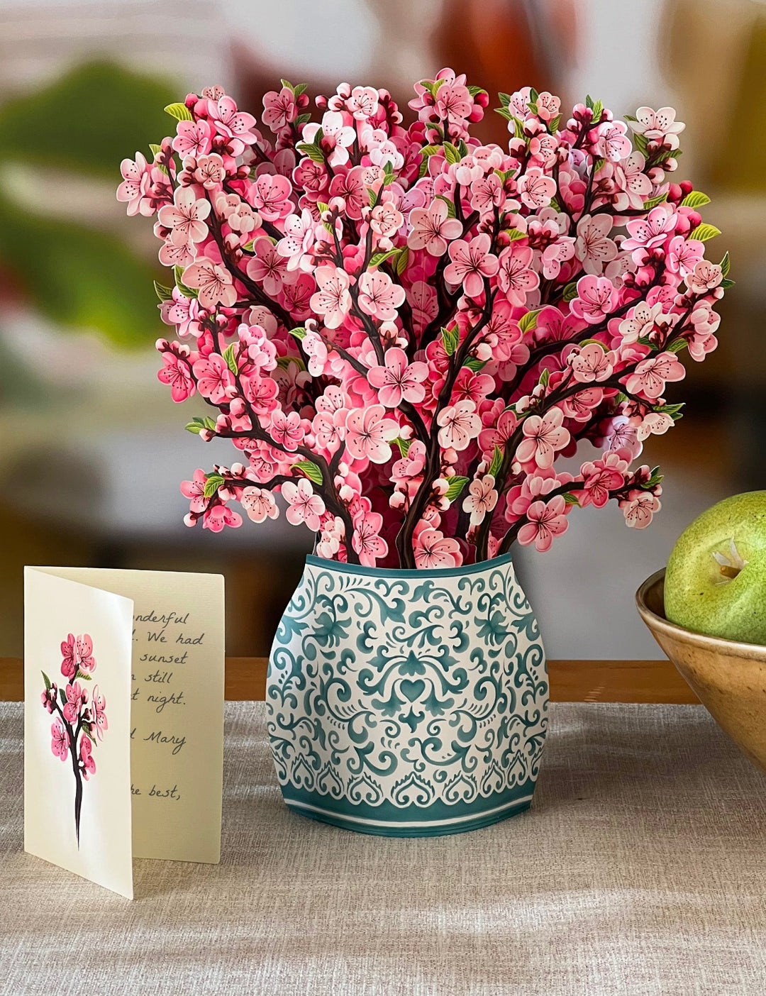 Our FreshCut Paper Cherry Blossoms come ready to present in their own festive blue and white patterned vase. More than a greeting card, our flowers are always FreshCut Paper that never wilt, fade or require water.