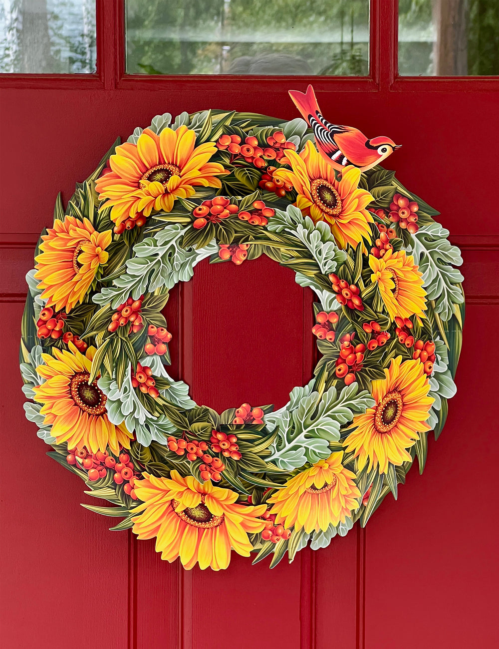 Welcome the season with FreshCut Paper's spectacular sculptural pop-up wreath! This elegant table centerpiece or door hanging wreath features autumnal visions of sunflowers, hypericum berries, and dusty miller, and an attachable song bird for extra festivity.