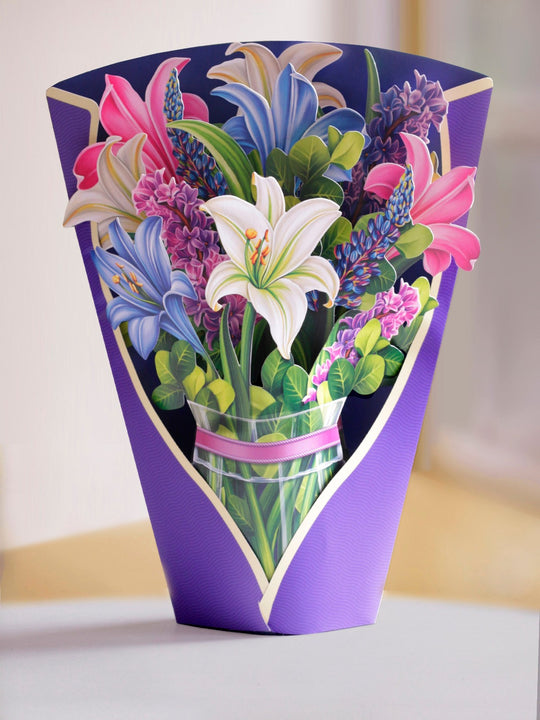 FreshCut Paper Lilies & Lupines comes with a colorful purple vase for you to display your paper, pop up bouquet.. Share your thoughts of love and concern or just send a greeting to say you're thinking of them. FreshCut Paper is not just any greeting card, our flower bouquets pop up and bloom before your eyes!
